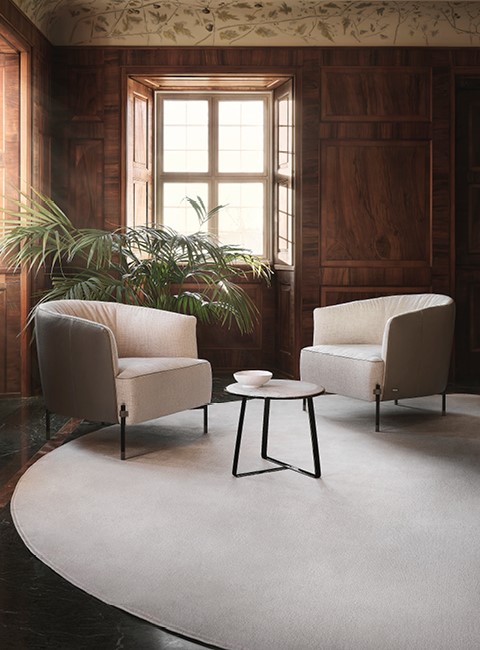 Nicoline Diga Italian armchairs in a contemporary room
