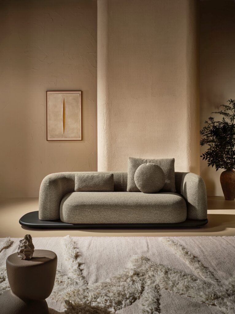 Italian living room with large sectional sofa and artwork