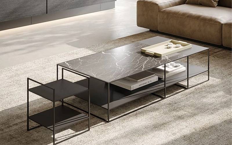 Modern rectangular rug under a marble coffee table.