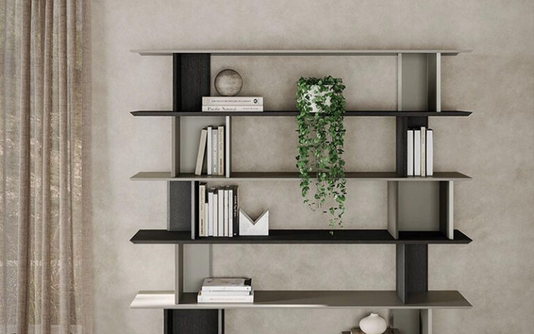 A stylish, floor-to-ceiling modern bookshelf in a minimalist home