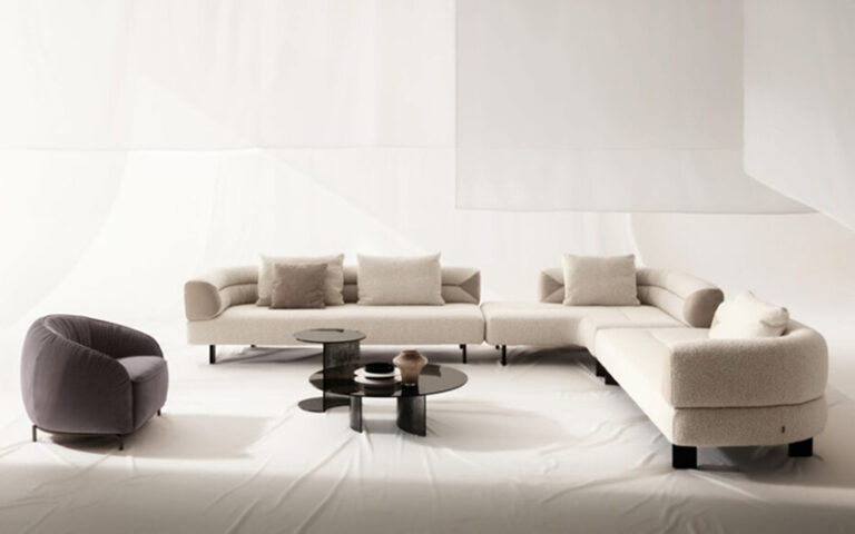 Sophisticated living space with layered neutral fabrics and smooth surfaces.